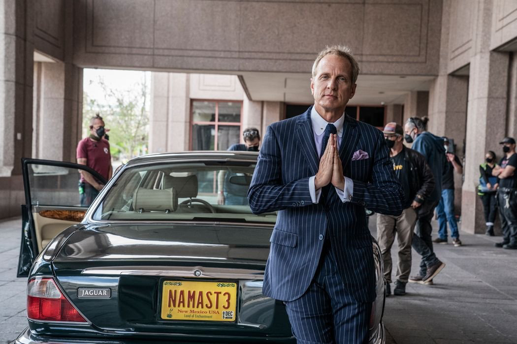
  Patrick Fabian smiling at the camera in front of Howard's Jaguar.